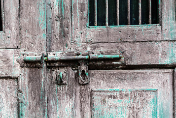 Old lock on old grunge wooden door