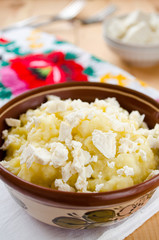 Traditional Ukrainian millet-porridge with butter and cheese