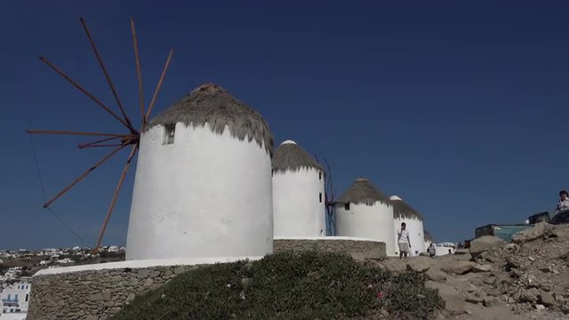Mykonos Greece White washed wind mills above Mediterranean Sea 4K 157