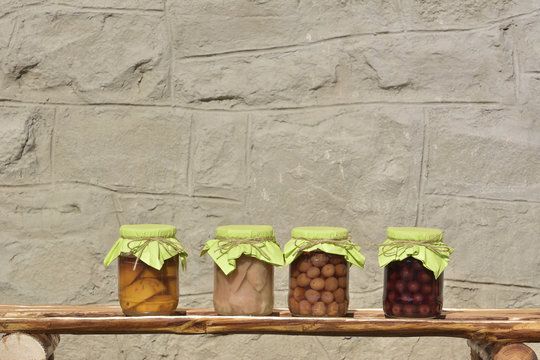Jars with fruity compotes . Preserved fruits.