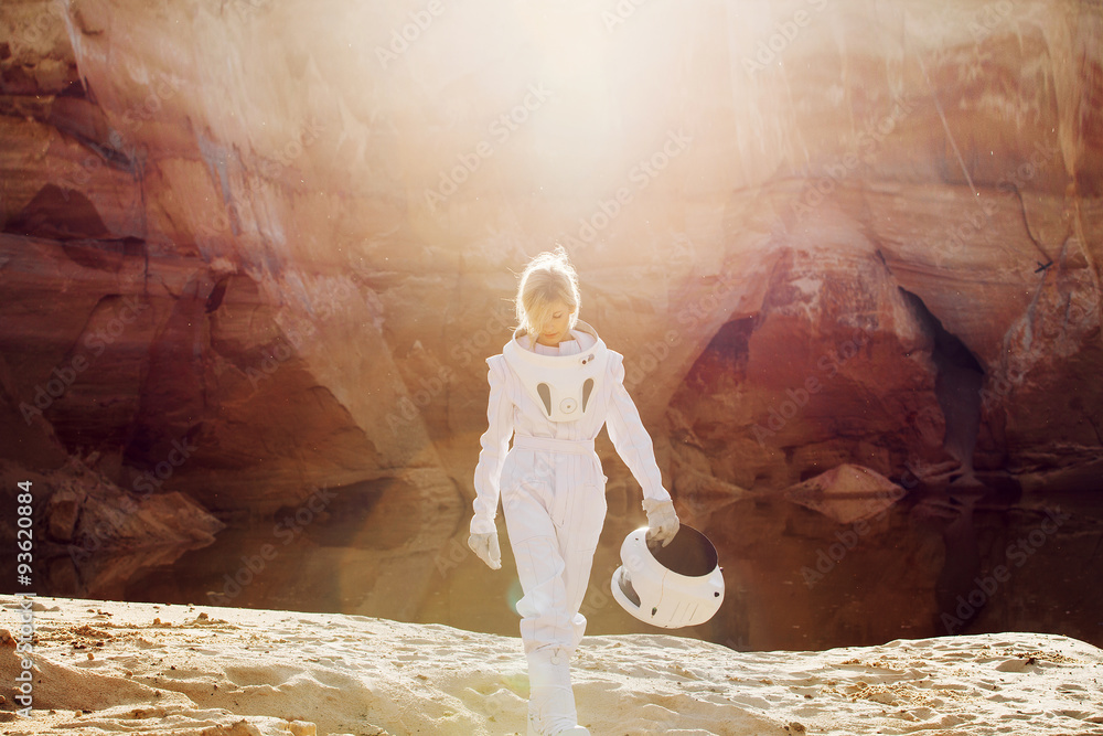 Canvas Prints futuristic astronaut without a helmet in rays of another sun