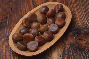 Chestnuts on wooden background
