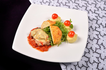 pork rind cheese with tomato and pepper sauce, mashed potatoes,