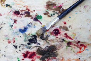 Brush on colorful stained cloth