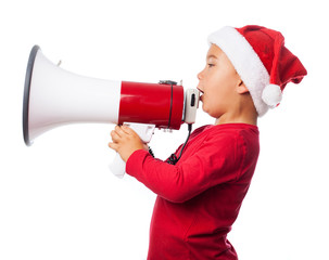 A little boy shouting with a megaphone