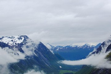 Fototapeta na wymiar Foggy mountains in Norway