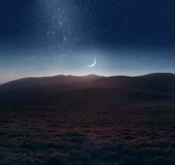 Foto auf Glas Crescent moon over the mountains © Yuriy Mazur