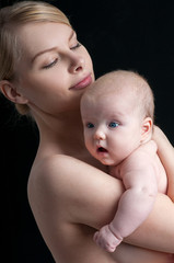 Young mother with a charming baby.Happy family. Mom's love and t