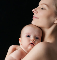 Young mother with a charming baby.Happy family. Mom's love and t