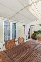 Covered patio with garden furniture