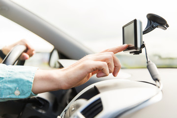 close up of man with gps navigator driving car