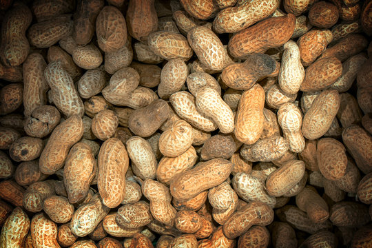 Roasted peanuts macro high contrasted with vignetting effect background