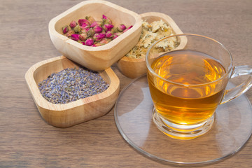 varieties of flower tea on wooden bowl