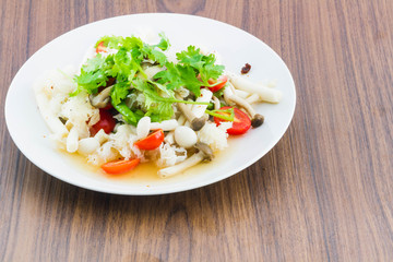 Mushroom spicy salad on the wood background - Vegetarian Food