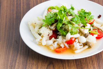 Mushroom spicy salad on the wood background - Vegetarian Food