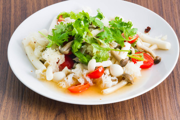 Mushroom spicy salad on the wood background - Vegetarian Food