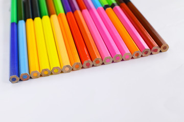 Naklejka premium Closeup of Colour pencils on white background, selective focus