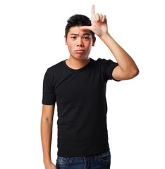 Fototapeta premium chinese man doing a looser gesture