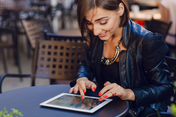 Fototapeta premium beautiful girl enjoys gadgets