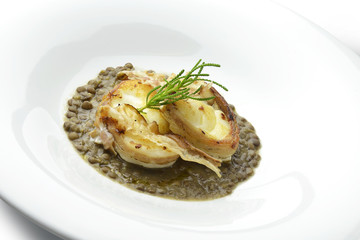 Monkfish with crispy bacon on lentils