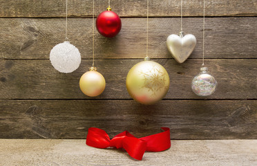 Christmas decoration balls hanging on a wooden wall