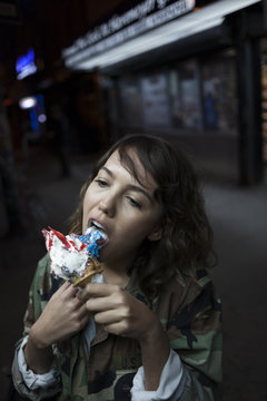 Young woman eating an ice cream