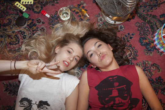 Portrait of young women relaxing on floor
