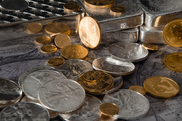 Gold & Silver Coins with Silver Bars on map