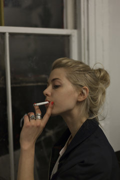 Young woman posing with a cigarette
