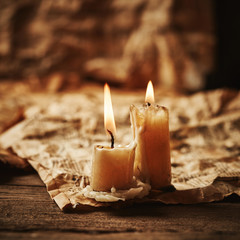 Vintage music sheets with candle