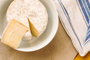 caciotta slice over whole mature cheese