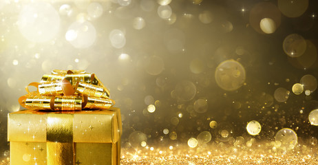 Christmas Present With Golden Sparkling Background
