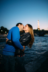 lovers couple near the Eiffel tower in Paris