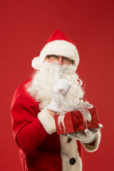 Portrait of happy Santa Claus with a huge sack
