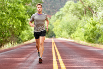 Sport and fitness runner man running on road