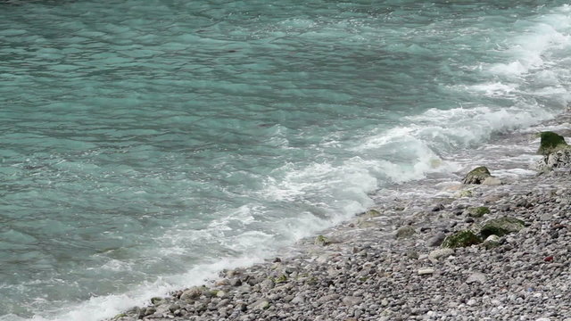 Ocean waves on rocky beach P HD 8387
