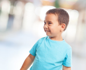 portrait of a little boy with happy gesture