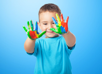 portrait of cute kid playing with paint