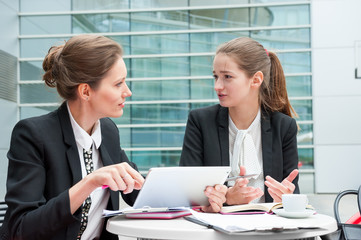 Two young business women