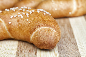 Macro photo of fresh homemade rolls. Studio shot, Photographed on wooden table.