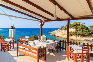 Typical Greek tavern in Kokkari bay, Samos island, Greece