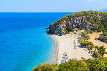 Fototapeta na wymiar A view of Tsambou beach with azure sea water, Samos island, Greece