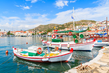 Naklejka na ściany i meble Traditional colourful Greek fishing boats in Pythagorion port, Samos island, Greece