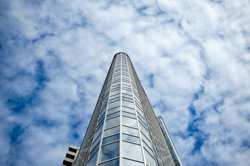 Fototapeta na wymiar skyscraper on a background of clouds