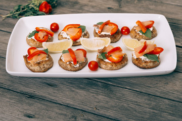 Blinis on the wooden table, Salmon sandwich .