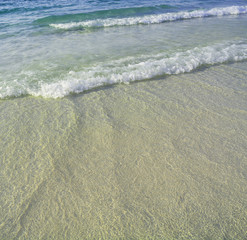 Beach sand and sea water closeup
