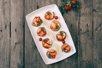 Blinis on the wooden table, Salmon sandwich .