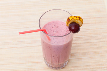 A kefir smoothie made with frozen cherries and a ripe banana