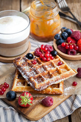 Belgian waffles with fresh berries and cappuccino