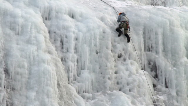 Ice climber rappel down mountain P HD 8922